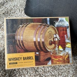 Whiskey barrel drink dispenser.